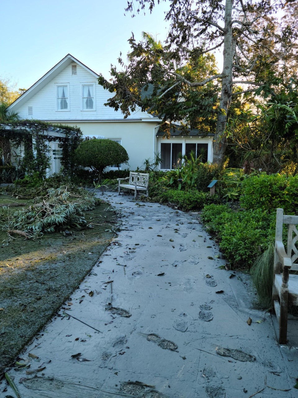 The Norris Gardens walking path with the majestic Cottage in the background